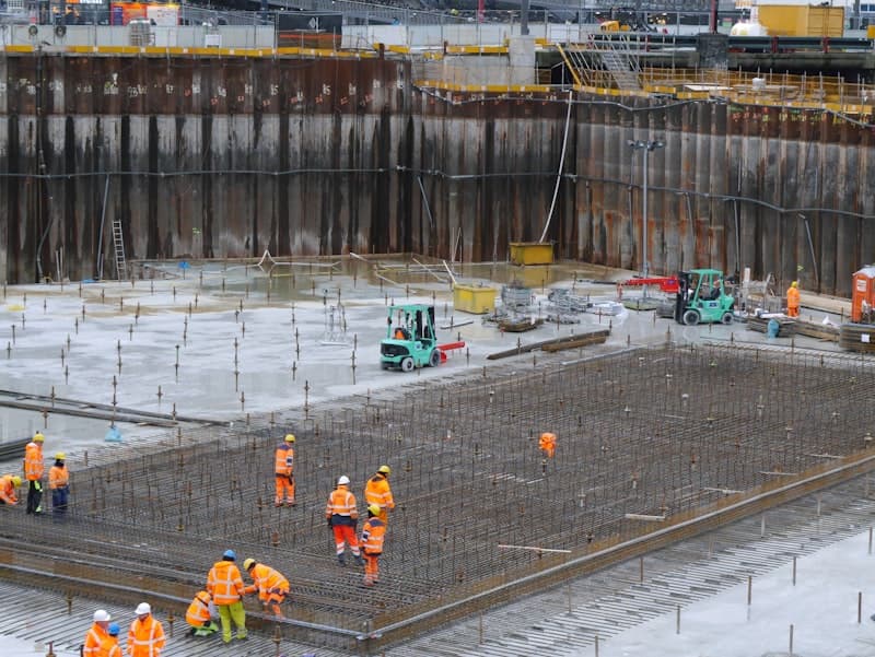 Groundworkers preparing a foundation excavation