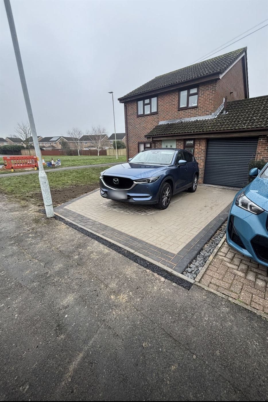 Buff block paving driveway finished with a charcoal border course, Norwich