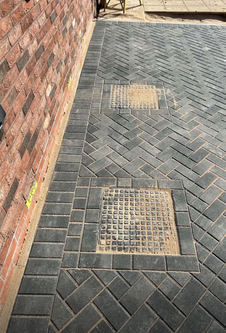 Herringbone paving with recessed inspection covers, Norfolk