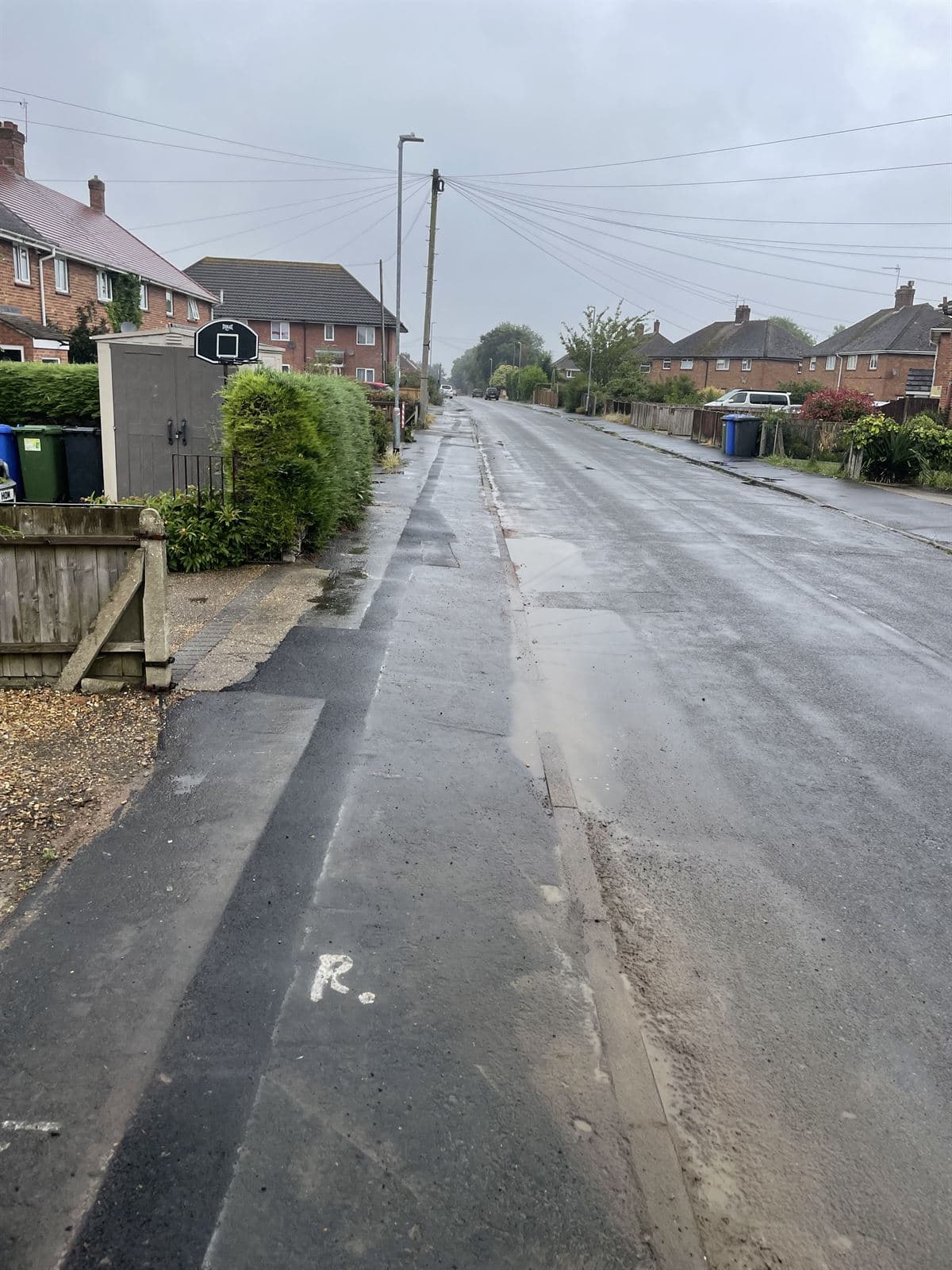 Resurfaced residential road and footway after utility installation